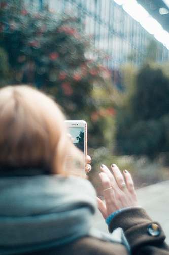 cell phone person holding white iPhone close-up photography mobile phone